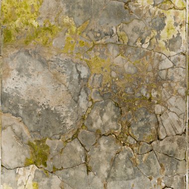 Old stone wall texture background with green moss and lichen, grunge style
