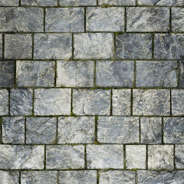 Stone pavement background. Close up of cobblestone pavement texture.