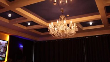 beautiful glass chandelier on the ceiling in the restaurant