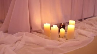 decorative candles on the floor near the wedding table in the restaurant