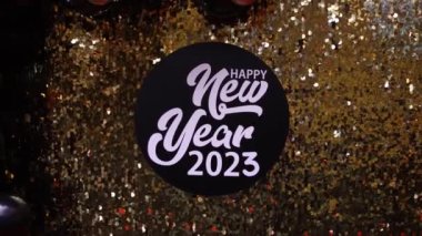 the inscription new year 2023 on the wall of the photo zone, the background of the celebration of the new year
