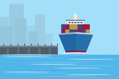 cargo ship at the pier in the city docks with port containers