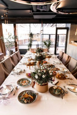 a food and drinks on the table in the restaurant on the wedding day luxury