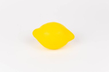 plastic children's toy lemon on a white background