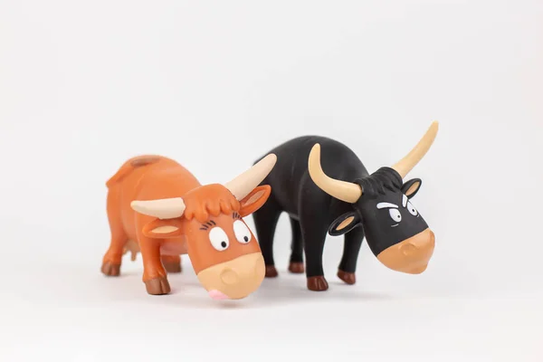 A figure of a bull and a cow children\'s toy on a white background
