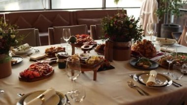 food and drinks on a table in a restaurant at a wedding, birthday, anniversary