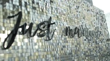 the inscription just married on the wall, wedding decor