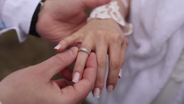 Groom Puts Golden Wedding Ring Bride Hand — Stock Video