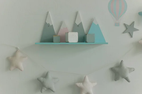 stock image a children's shelf with toys on the wall in the room