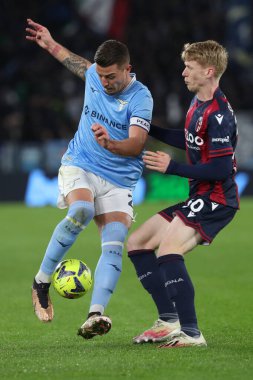 Rome, Italy 19.01.2023:  Milinkovic Savic (Lazio), Jerdy Schouten (Bol) in action during  the Freccia Rossa Italy Cup match between SS Lazio and Bologna  at Stadio Olimpico on January 19, 2023 in Rome, Italy.