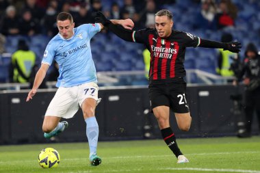 Rome, Italy 24.01.2023: Adam Marusic (Lazio) in tackle on Sergio Dest (Milan) during the Serie A match day 19 between SS Lazio and AC Milan at Stadio Olimpico on January 24, 2023 in Rome, Italy.