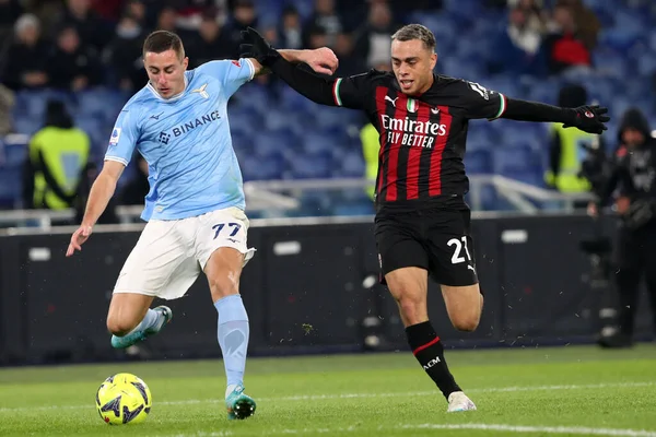 Rome, Italy 24.01.2023: Adam Marusic (Lazio) in tackle on Sergio Dest (Milan) during the Serie A match day 19 between SS Lazio and AC Milan at Stadio Olimpico on January 24, 2023 in Rome, Italy.