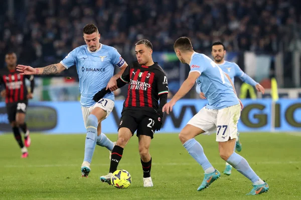 Rome, Italy 24.01.2023: Milinkovic Savic (Lazio), Sergio Dest (Milan) in action during the Serie A match day 19 between SS Lazio and AC Milan at Stadio Olimpico on January 24, 2023 in Rome, Italy.