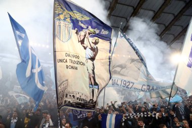 Rome, Italy 19.03.2023: Choreography of the Lazio fans in the Curva Nord before the Serie A Championship, football match derby between SS Lazio vs AS Roma at Stadio Olimpico in Rome, Italy. clipart