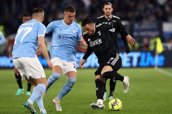 stock image Rome, Italy 08.04.2023: Milinkovic Savic (Lazio), Filip Kostic (Juventus)  in action during the Serie A 2022/2023 championship soccer match, day 29, between SS Lazio vs FC Juventus Turin at Olympic stadium in Rome, Italy.