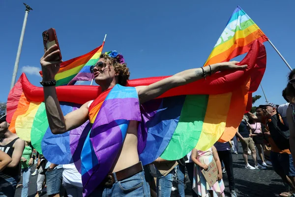 stock image Rome, Italy 10.06.2023:  More than one hundred thousand people from all over Europe paraded at the 2023 Rome Gaypride through the streets of the capital Rome up to the Colosseum.