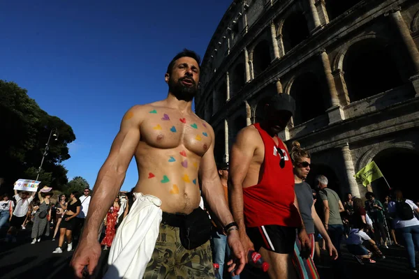 stock image Rome, Italy 10.06.2023:  More than one hundred thousand people from all over Europe paraded at the 2023 Rome Gaypride through the streets of the capital Rome up to the Colosseum.