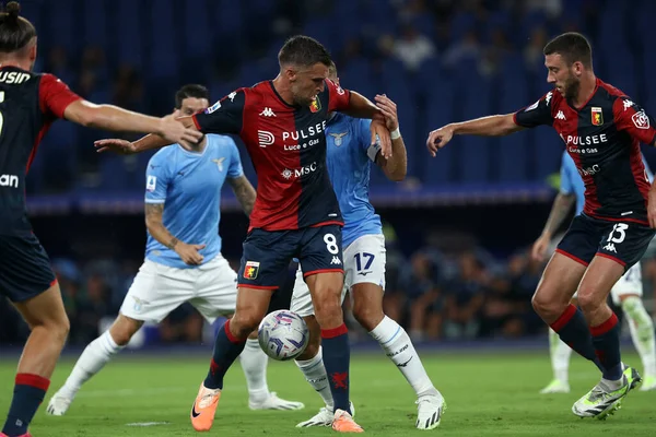 stock image Rome, Italy 27.08.2023: Kevin Strootman of Genoa, Ciro Immobile of Lazio in action during the Italy Serie A TIM 2023-2024 football match day 2, between SS Lazio vs Genoa CFC at Olympic Stadium in Rome.