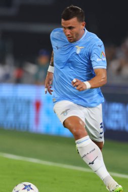 Roma, İtalya 19.09.2023: Lazio 'lu Luca Pellegrini, Uefa Şampiyonlar Ligi 2023-2024, E grubu, SS Lazio ile Atletico de Madrid arasında Roma Olimpiyat Stadyumu' nda oynanan karşılaşma sırasında eylem halindeydi..