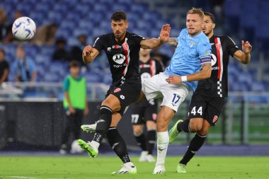Roma, İtalya 23.09.2023: Monza 'dan Pablo Mari, Lazio' dan Ciro Immobile İtalya Serie A TIM 2023-2024 5 günlük futbol karşılaşması sırasında Roma Olimpiyat Stadyumu 'nda SS Lazio' ya karşı AC Monza.