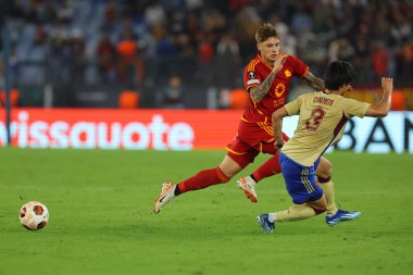 Rome, Italy 05.10.2023:  Nicola Zelewski of Roma, Keigo Tsunemoto of Servette  in action during the UEFA Europa League 2023-2024, group G, football match between AS Roma vs Servette FC at Olympic Stadium in Rome. clipart