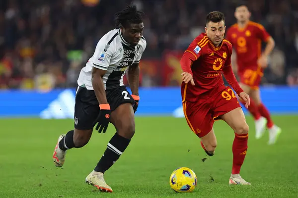 stock image Rome, Italy 26.11.2023: Ebosele of Udinese fight for the ball against Stephan El Shaarawy of Roma in the Italy Serie A TIM 2023-2024, football match between AS Roma vs Udinese Calcio at Olympic Stadium in Rome.