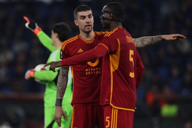 Rome, Italy 07.03.2024:   Gianluca Mancini of Roma talk with Evan Ndicka of Roma during the UEFA Europa League 2023-2024, round 16, football match between AS Roma vs Brighton & Hove Albion at Olympic Stadium in Rome. clipart