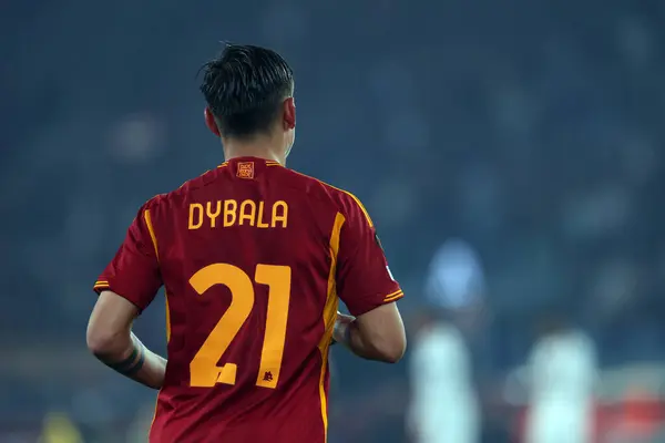 stock image Rome, Italy 18.04.2024:  Paulo Dybala of Roma score the goal 2-0 and celebrate with the team during the UEFA Europa League 2023-2024, quarter final , football match between AS Roma vs AC Milan at Olympic Stadium in Rome.