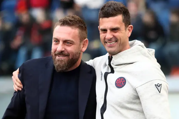 stock image Rome, Italy 22.04.2024: Daniele De Rossi coach of Roma greet Thiago Motta of Bologna before  Italian Serie A TIM 2023-2024 football match derby AS ROMA vs BOLOGNA FC 1909 at Olympic Stadium in Rome.