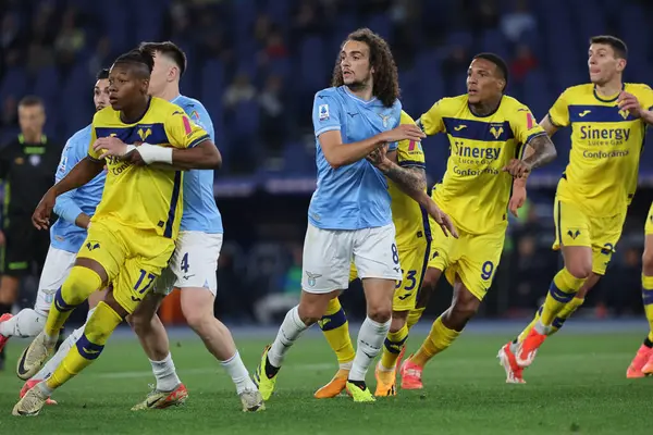 stock image Rome, Italy 27.04.2024:  Tijjani Noslin of Verona , Matteo Guendouzi of Lazio during Serie A Tim 2023-2024 football match SS LAZIO  vs HELLAS VERONA at Olympic Stadium in Rome.