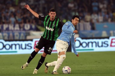 Roma, İtalya 26.05.2024: Sassuolo 'dan Luca Lipani, İtalya Serisi A TIM 2023-2024 futbol karşılaşması sırasında Lazio' dan Daichi Kamada Roma 'daki Olimpiyat Stadyumu' nda SS LAZIO - SASSUOLO.