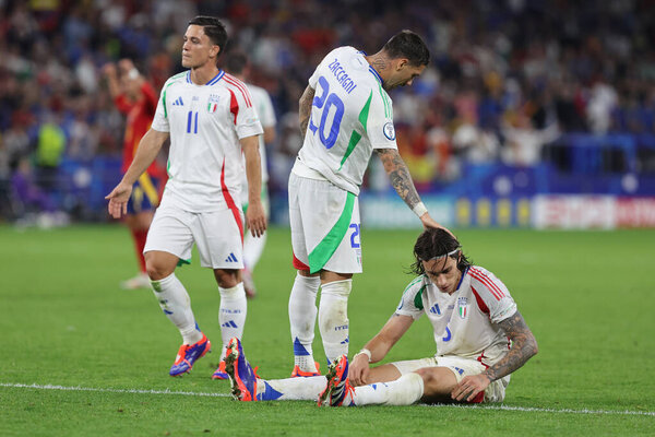 Gelsenkirchen, Germany 20.06.2024:  disappointment after defeat Mattia Zaccagni of Italy, Riccardo Calafiori of Italy at end of  the UEFA EURO 2024 group stage B football match between Spain vs Italy at Veltins Arena stadium in Gelsenkirchen.