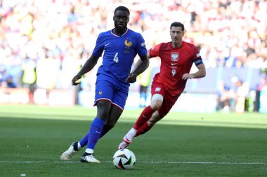 Dortmund , Germany 25.06.2024: Ferland Mendy of France, Robert Lewandowski of Poland during the UEFA EURO 2024 Matchday 3, group stage D football match between France vs Poland at BVB Stadion Dortmund. clipart