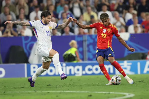 stock image Munich , Germany 09.07.2024:Lamine Yamal of Spain, Theo Hernandez of France  during the UEFA EURO 2024 semi-finals, football match between Spain vs France at Munich Football Allianz Arena