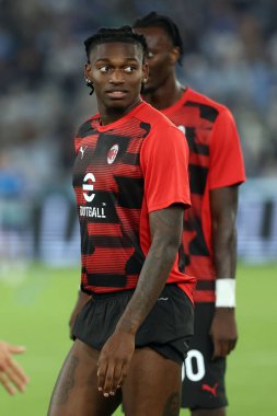 Rome, Italy 31.08.2024 : Rafael Leao of Milan,  Tammy Abraham of Milan during warm up before Italian football championship Serie A Enilive 2024-2025  match SS Lazio vs AC Milan at Stadio Olimpico in Rome on August 31, 2024. clipart