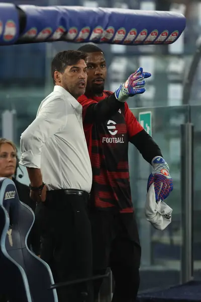 stock image Rome, Italy 31.08.2024 : Paulo Fonseca coach of Milan, Mike Maignan of Milan during Italian football championship Serie A Enilive 2024-2025  match SS Lazio vs AC Milan at Stadio Olimpico in Rome on August 31, 2024.