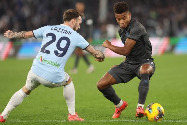 Rome, Italy 5.12.2024 : Manuel Lazzari of Lazio, David Neres of Napoli seen  in action during Italian football match Freccia Rossa Coppa Italia (Italy Cup) 2024-2025  SS Lazio vs SSC Napoli at Olympic stadium in Roma. clipart