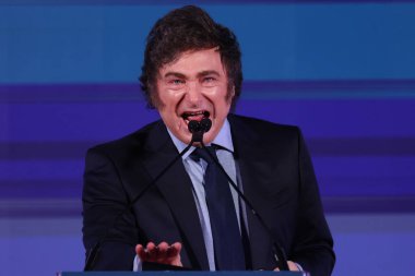 Rome, Italy 14.12.2024:  Argentine president Javier Milei speaks during the political event organized by the governing party Fratelli D'Italia called Atreju 2024 at the Circo Massimo in Rome clipart