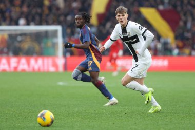 Rome, Italy 22.12.2024 : Manu Kone of Roma, Adrian Benedyczak of Parma during Italian football championship Serie A Enilive 2024-2025  match AS Roma vs Parma Calcio at Stadio Olimpico in Rome. clipart