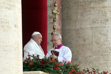 Vatican City, Italy 25.12.2024: Pope Francis from the central loggia imparts the solemn blessing Urbi et Orbi to the faithful and pilgrims gathered in St. Peter's Square on the occasion of Christmas and the opening of the Holy Door for the Jubilee 20 clipart