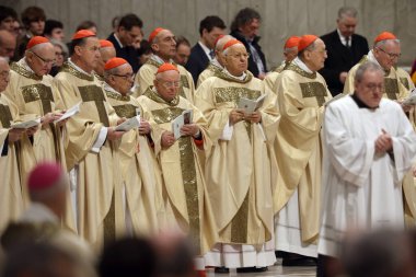 Vatican City, Italy 24.12.2024 :  Cardinals pray during Christmas Mass in front of thousands of faithful, in St. Peter's Basilica Vatican City Rome clipart