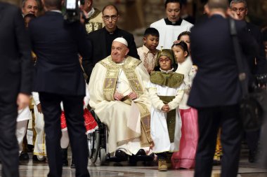 Vatican City, Italy 24.12.2024 : Pope Francis he goes away in a wheelchair and blesses and greets the faithful at the end in St. Peter's Basilica for the Jubilee 2025, celebrates Christmas Mass in front of thousands of faithful, in St. Peter's Basili clipart