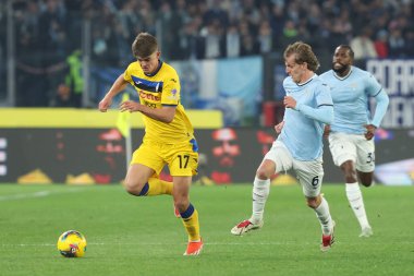 Rome, Italy 28.12.2024 : De Ketelaere of Atalanta , Nicolo Rovella of Lazio during Italian football championship Serie A Enilive 2024-2025  match SS Lazio vs Atalanta Bergamasca Calcio at Stadio Olimpico in Rome. clipart