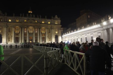 Vatican City, Italy 31.12.2024 : Crowds of faithful and pilgrims leave the basilica after attending Pope Francis' celebration of the mass of First Vespers and Te Deum in thanksgiving for the past year In Altar of the Confessio, St. Peters Basilic clipart