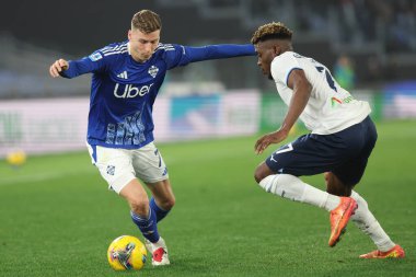 Rome, Italy 10.01.2025 : Van der Brempt of Como, Fisayo Dele-Bashiru of Lazio during Italian football championship Serie A Enilive 2024-2025  match SS Lazio vs Como 1907 at Stadio Olimpico in Rome. clipart