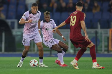 Rome, Italy 6.03.2025:  Maroan Sannadi of Bilbao, Nico Williams of Bilbao, Zeki Celik of Roma seen in action during the Uefa Europa League 2024-2025, Round of 16, football match between AS Roma vs Athletic Club Bilbao at Olympic Stadium in Rome. clipart