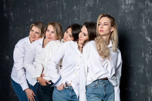 Young Attractive Women White Shirts Jeans Posing Studio — Stockfoto