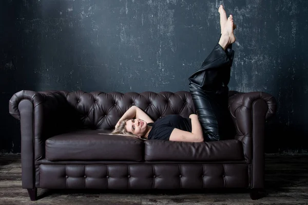 Beautiful Young Woman Lying Sofa Stock Image