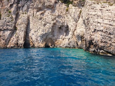 Stunning waters of Zakynthos, Greece, surrounded by crystal-clear blue seas and majestic cliffs, creating an unforgettable experience of natural beauty. clipart