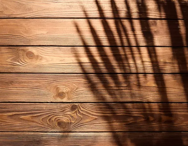 stock image top view of soft brown table with high resolution texture and palm leafs shadows, summer table background with empty space for text or design, soft cozy sunny table backdrop, wooden texture seamless